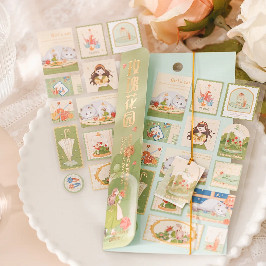 Set of decorative stickers with cats on a white plate.