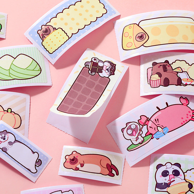 Set of cartoon-themed mini sticker post-it notes on a pink background