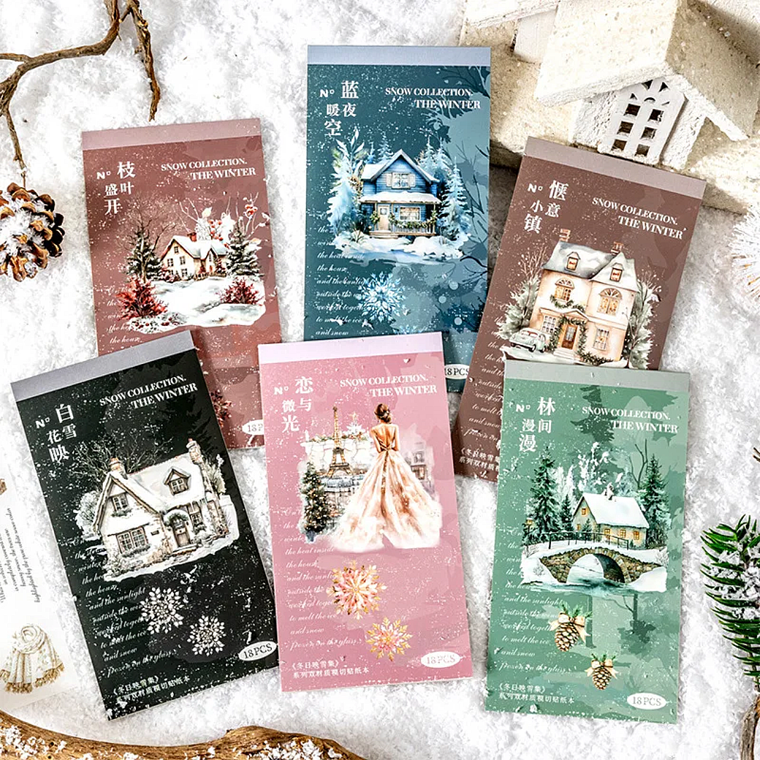 Set of winter-themed sticker books with snowy landscapes and houses on a snowy background.
