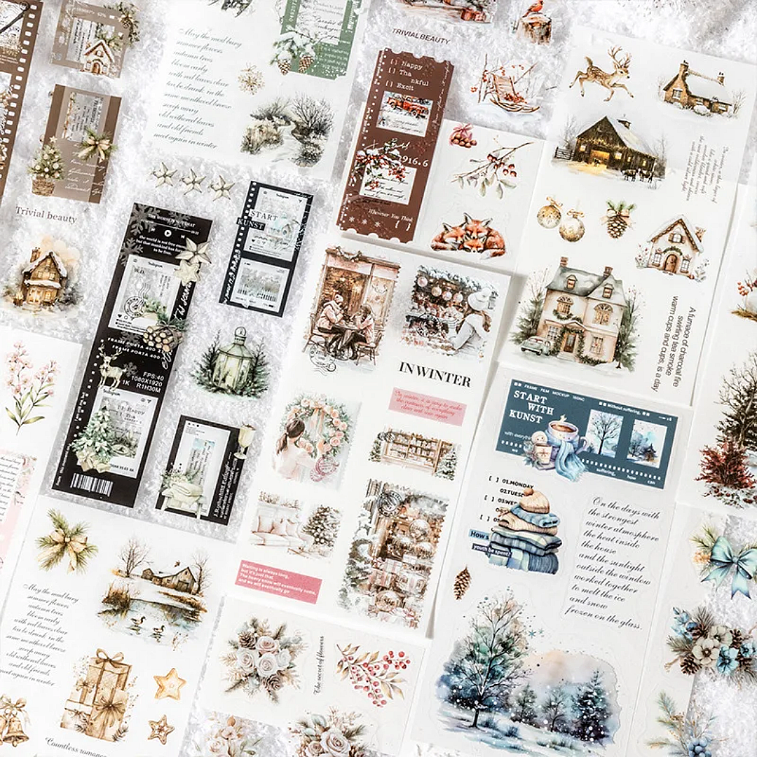 Collection of winter-themed washi paper and P.E.T sheets from inside the sticker books