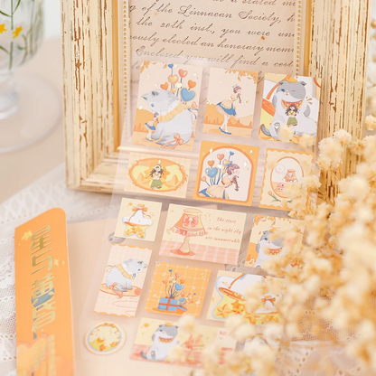 Set of decorative stickers with cats and girl characters on a textured surface.