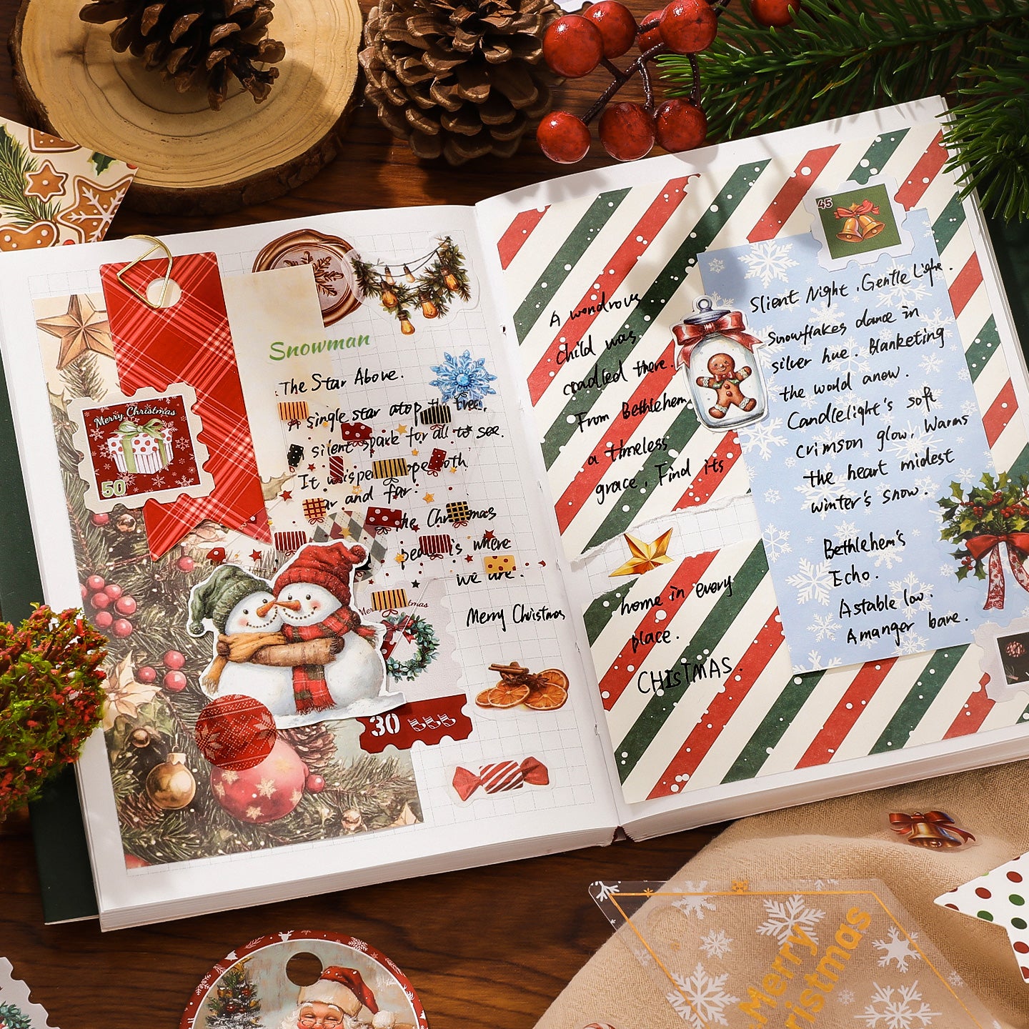 Open book with Christmas-themed pages featuring snowmen, ribbons, and festive text on a wooden surface.