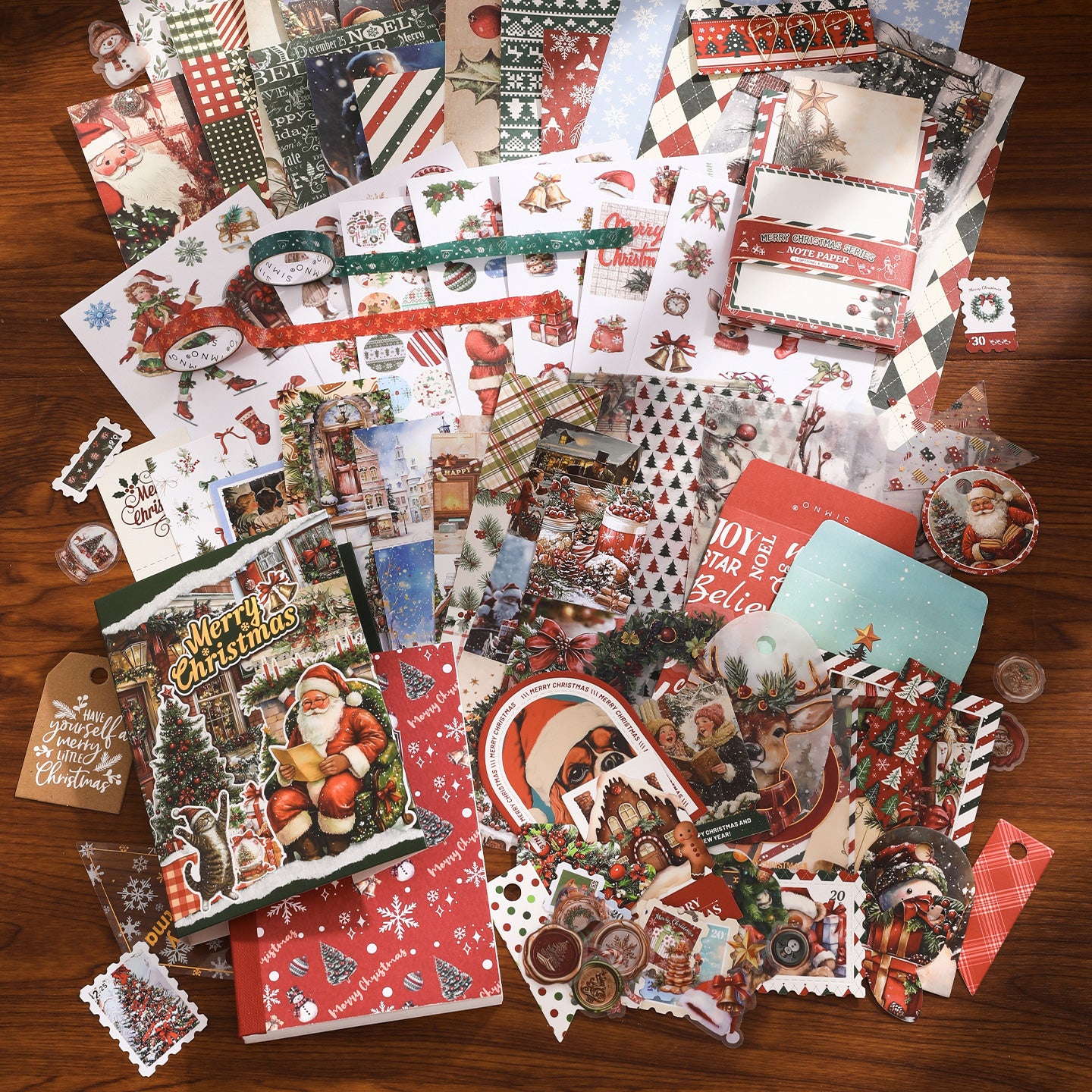 Collection of Christmas-themed stationery items on a wooden surface