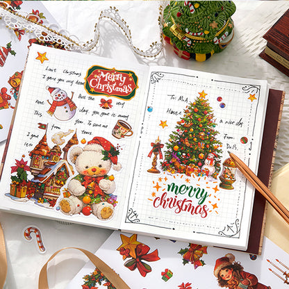 Christmas-themed stationery set with cards and decorations on a festive background