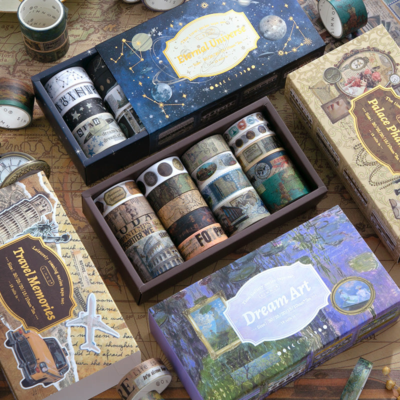 Set of washi tape rolls in decorative boxes on a wooden surface