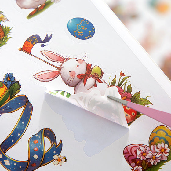 Sheet of Easter-themed temporary tattoos with a rabbit and eggs design, featuring a pen for application.